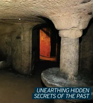  ??  ?? Inside one of the many caves beneath Nottingham’s streets and, below, city archaeolog­ist Scott Lomax sheds light on the structures