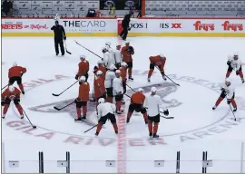  ?? CHRISTIAN PETERSEN — GETTY IMAGES ?? The Coyotes practice at Gila River Arena, where the Sharks will open the season Thursday.