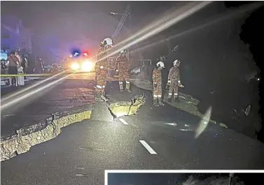  ?? ?? Off limits to civilians:
Firemen inspecting the soil erosion and widening cracks on the residentia­l road in Lobak. (Inset) cars that collapsed with the slope along Jalan bukit berlian 5 (above) are being pulled out. the housing area has been declared a disaster zone