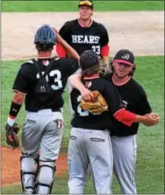  ?? AUSTIN HERTZOG - DIGITAL FIRST MEDIA ?? Boyertown pitcher Pat Hohlfeld, right, who got the save, hugs Tyler Kreitz as first baseman Ben Longacre, rear, joins catcher Ryan Weller in the celebratio­n after the Bears won their PIAA Class AAAA semifinal over Cumberland Valley Monday.