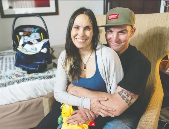  ?? PHOTOS: RICHARD LAM ?? Brad Wernicke and Becky Bird in their Abbotsford motel room. After months of living in a tent, the couple was offered the room in time for Becky to give birth to son Elijah, below, who is still in a hospital neo-natal unit in Abbotsford. “It was really amazing we were able to get help,” says Wernicke, “because we were really not knowing what the hell we were going to do.”