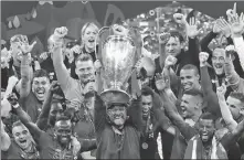  ?? AP ?? Klopp lifts the Champions League trophy as Liverpool celebrates winning the final against Tottenham Hotspur in Madrid in 2019.