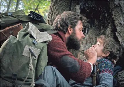  ?? JONNY COURNOYER/PARAMOUNT ?? A father and his son (John Krasinski and Noah Jupe) have to keep it down in “A Quiet Place.”