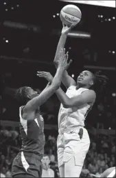  ?? KATHARINE LOTZE/GETTY IMAGES/TNS ?? Forward Nneka Ogwumike of the Sparks goes up for a shot as forward Natasha Howard of the Seattle Storm blocks on Sept. 15, 2019 in Los Angeles.