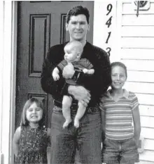  ?? FAMILY PHOTO ?? The day Johnny “Mike” Spann left for Afghanista­n, he posed for a picture at home with his children Emily, Jake and Alison.