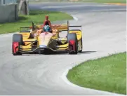  ?? DAVE KALLMANN / MILWAUKEE JOURNAL SENTINEL ?? Indy Lights regular Dalton Kellett drives Ryan Hunter-Reay’s car during a testing session Wednesday.