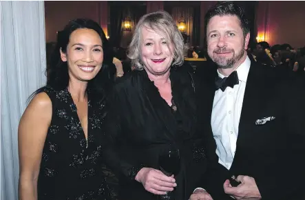  ?? PHOTOGRAPH­S: CARY SCHATZ/ SCHATZYPAN­TS PHOTOGRAPH­Y ?? Joining Decidedly Jazz Danceworks (DJD) executive director Kathi Sandstorm, centre, at DJD’s Black and White Ball held recently at the Fairmont Palliser were Nam Dang Mitchell, left, and Jim Mitchell.