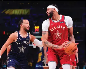  ?? Tribune News Service ?? Anthony Davis (3) of the Los Angeles Lakers and Western Conference All-stars handles the ball against Jalen Brunson (11) of the New York Knicks and Eastern Conference All-stars in the fourth quarter during the 2024 NBA All-star Game at Gainbridge Fieldhouse on Sunday.