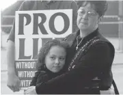  ?? RON HEFLIN/ASSOCIATED PRESS ARCHIVES ?? Norma McCorvey, right, attends an Operation Rescue rally in 1997 in Dallas, Texas. She later left the group.