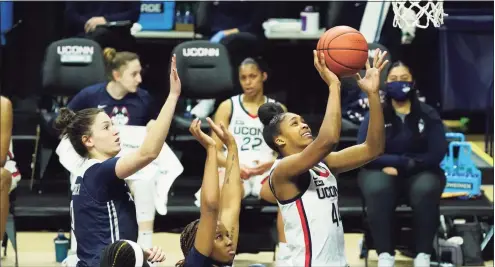  ?? David Butler II / Associated Press ?? UConn forward Aubrey Griffin (44) drives to the basket against Xavier in the second half at Harry A. Gampel Pavilion in Storrs in 2020.