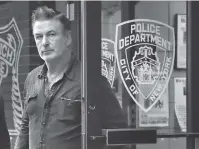  ?? AP PHOTO/JULIE JACOBSON ?? Actor Alec Baldwin walks out of the New York Police Department’s 10th Precinct on Friday.