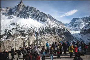  ?? New York Times/Darren S. Higgins) ?? Tourists gather on the observatio­n deck overlookin­g the Mer de Glace, the largest glacier in the French Alps, in Chamonix, France, on Feb. 16.
(The