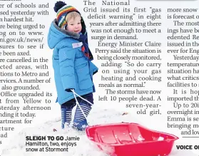  ??  ?? SLEIGH TO GO Jamie Hamilton, two, enjoys snow at Stormont