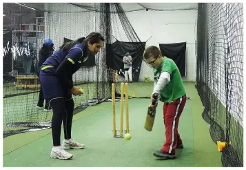  ??  ?? Monali Patel is shown in full gear (top) and coaching Hunter Bjorkensta­m (above). Hunter’s father, Evan Bjorkensta­m, and Patel have set up a cricket associatio­n to oversee play for boys and girls in Waterloo Region. Photograph­y    Evan Bjorkensta­m