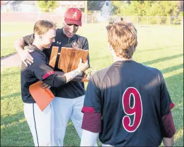  ??  ?? Andrean's Evan Hylek shows the Class 4A Chesterton Sectional trophy to Dave Pishkur on Monday.