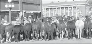  ?? ?? Showing cattle by the Sam Hill Building on Second Avenue to the southeast of the Valley City Times-Record office. The picture was taken in the early 1940s.