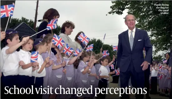  ?? PHOTO: JOHN RIFKIN ?? Pupils flying the flag for the royal visitor