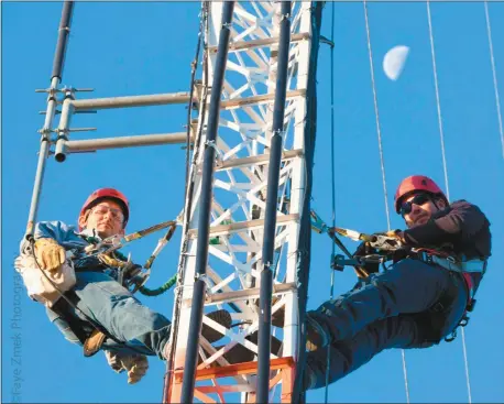  ?? CPPD photo ?? It’s all about communicat­ions, both within Custer Public Power District and across rural Nebraska. Above, working on a CPPD radio tower are Jeff Wardyn, Staking Technician, left, and Jon Berghorst, Journeyman Lineman.