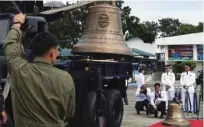  ?? - AFP ?? UNLOADING: Philippine military personnel unload one of the three Balangiga church bells shortly after it arrived from the US at a military airbase in Manila on December 11, 2018.