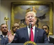  ?? ANDREW HARNIK/AP ?? President Donald Trump offers his support Wednesday for a major rewrite of the nation’s criminal justice sentencing laws. He hailed a congressio­nal deal as proof that “true bipartisan­ship is possible.”