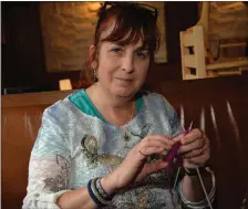  ??  ?? Mags Stockdale knitting a miniature jersey at Féile an Bhuailtín on Bank Holiday Monday. The jerseys, which are used to decorate greeting cards, are among a range of crafts that Mags sells through an Gailearaí Beag in Dingle. Photo by Declan Malone
