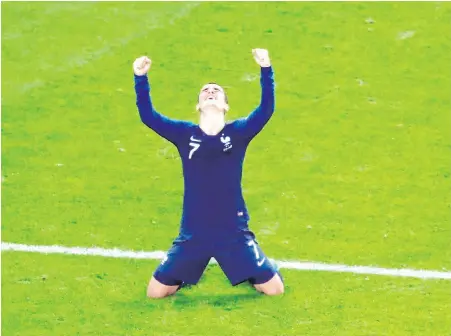  ??  ?? France’s Antoine Griezmann celebrates at the end of their semifinal against Belgium in St. Petersburg.