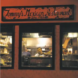  ??  ?? Longtime chef Rafael Granados cooks in the kitchen at Tommy's Mexican Restaurant on Geary Boulevard. The family restaurant opened in 1965, serving Yucatan-style food.