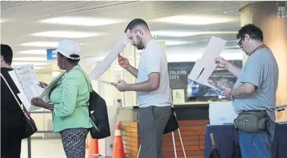  ?? STEVE RUSSELL TORONTO STAR ?? Voters line up at city hall to vote in an advance poll on Wednesday. There are 35 mayoral candidates and 242 council candidates running in 25 Toronto wards in the Oct. 22 election. The early voting runs until Sunday.