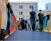  ?? Photo by Shihab ?? FRESH AIR: Residents take their afternoon strolls at Sharjah’s Qanat Al Qasba on Tuesday, as the emirate reopens some of its major leisure destinatio­ns. —