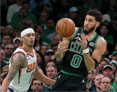  ?? 10) WATCHES AS THE CELTICS TAKE ON THE SUNS AT THE GARDEN ON FRIDAY NIGHT. (STUART CAHILL — BOSTON HERALD ?? Celtics forward Jayson Tatum cannot handle the rebound as Phoenix Suns guard Damion Lee
