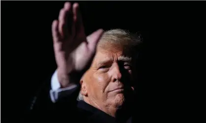  ?? Photograph: Drew Angerer/Getty Images ?? Donald Trump waves at the end of a rally at the Dayton Internatio­nal Airport in November 2022.