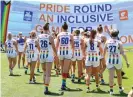  ?? ?? Kangaroos players run out before their game against GWS. Photograph: Kelly Defina/Getty Images