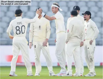  ??  ?? Stuart Broad celebrates taking the wicket of John Campbell