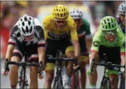  ?? PETER DEJONG — THE ASSOCIATED PRESS ?? Colombia’s Rigoberto Uran, right, crosses the finish line ahead of ahead of France’s Warren Barguil, left and Britain’s Chris Froome, center to win the ninth stage of the Tour de France.