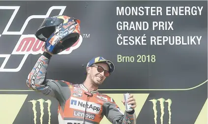  ?? Picture: AFP ?? MILESTONE. Andrea Dovizioso of Italy celebrates on the podium after the Czech Republic MotoGP at the Masaryk Circuit in Brno yesterday.