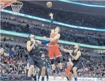  ?? DAVID BANKS/AP ?? The Bulls’ Lauri Markkanen, who finished with 32 points on Friday, shoots over the Magic’s Nik Vucevic, who posted 19 points and 19 rebounds, in Orlando’s 90-80 road loss. The Magic host Miami on Sunday.