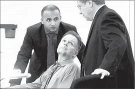  ?? John Gibbins U-T San Diego ?? ACCUSED KILLER Chase Merritt, center, speaks with defense attorneys Jim Terrell, right, and Jimmy Mettias before his preliminar­y hearing Monday.