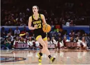  ?? Steph Chambers/Getty Images ?? Iowa’s Caitlin Clark looks on in the second half during the NCAA Women’s Basketball Tournament National Championsh­ip game against South Carolina at Rocket Mortgage FieldHouse last Sunday in Cleveland, Ohio.