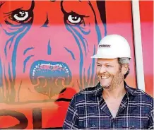  ?? [PHOTO BY JIM BECKEL, THE OKLAHOMAN] ?? Blake Shelton smiles after taking part in a ceremonial nail driving event to turn two buildings on Tishomingo’s Main Street into his Ole Red entertainm­ent and retail venue.