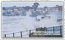  ??  ?? Huge waves crash into Dun Laoghaire harbour