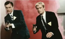  ?? UNCLE. Photograph: NBC/Allstar ?? David McCallum, right, as the secret agent Illya Kuryakin with Robert Vaughn as Napoleon Solo in a 1964 episode of The Man from