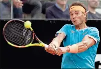  ?? AP-Gregorio Borgia ?? Rafael Nadal of Spain returns the ball to Novak Djokovic of Serbia during their final match at the Italian Open tennis tournament in Rome on Sunday.