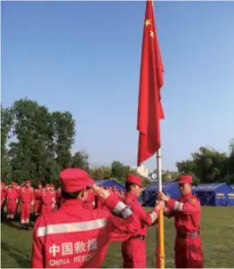  ??  ?? Members of China Internatio­nal Search and Rescue Team attend a flag-raising ceremony while carrying out post-earthquake relief work in Katmandu, Nepal, on May 1, 2015