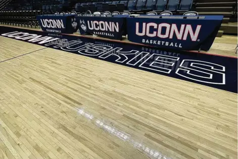  ?? Mike Anthony/Hearst Connecticu­t Media ?? The court at Gampel Pavilion, in place since the building’s opening in 1990, will be removed and replaced this spring. Sections of the original court will be sold.