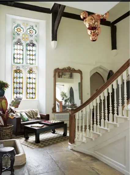  ??  ?? Left This cosy nook in the hall makes the most of the light from the magnificen­t stained-glass window and is Isabel Howett’s favourite place to catch up with her reading