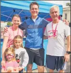  ??  ?? ■ Doctor Ben Noble, who plans to Race for Life at home, is pictured here with his family at a previous Race for Life event in Loughborou­gh.