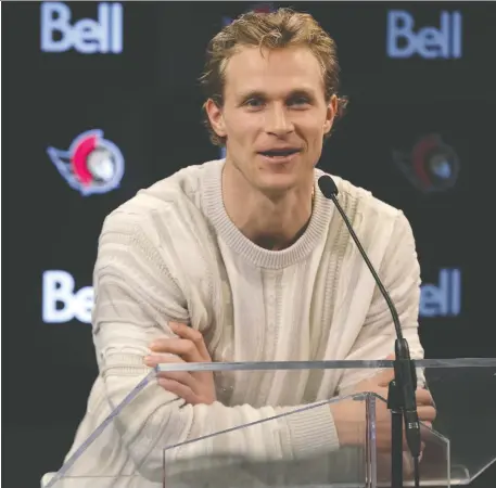  ?? JULIE OLIVER ?? Senators defenceman Jakob Chychrun meets with the media for a final time this season as players cleaned out their lockers Thursday.