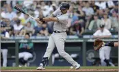  ?? JOHN FROSCHAUER – THE ASSOCIATED PRESS ?? Yankees designated hitter Matt Carpenter fouls a ball off his left foot during the first inning Monday night in Seattle.