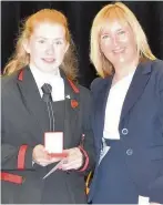  ??  ?? Medal magic Mrs O’Neill congratula­tes dux Laurie Anderson