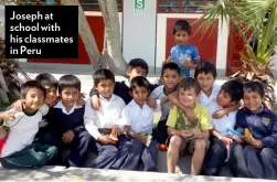  ??  ?? Joseph at school with his classmates in Peru